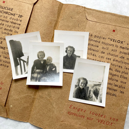 1940s vintage photographs lot featuring assorted black and white family portraits and scenes on a classic Kodaks bag.
