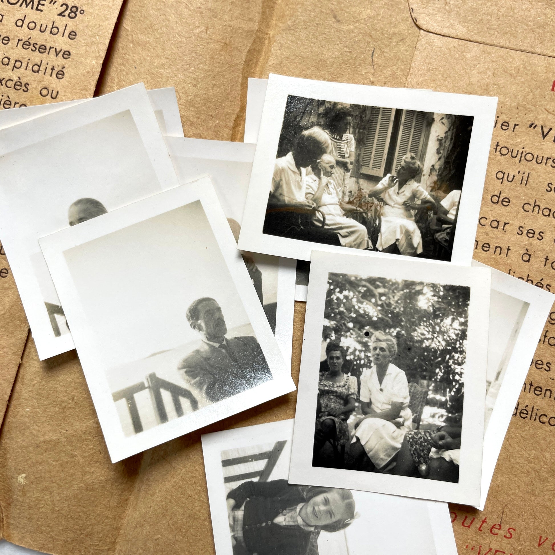 1940s vintage photographs lot featuring assorted black and white family portraits and scenes on a classic Kodaks bag.