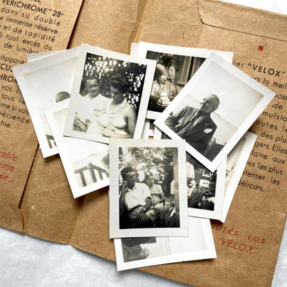 1940s vintage photographs lot featuring assorted black and white family portraits and scenes on a classic Kodaks bag.
