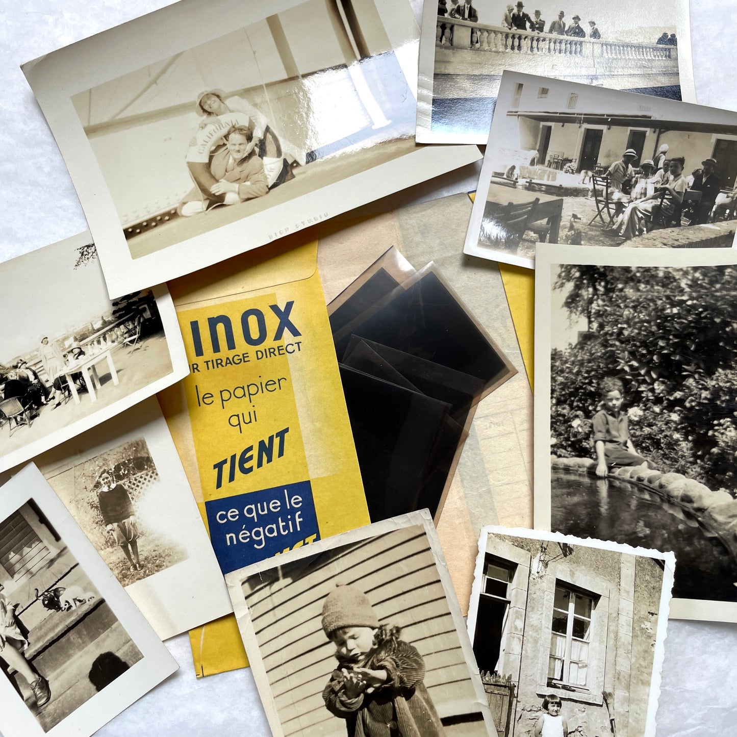 1930s vintage photo lot with French family scenes and original negatives, capturing nostalgic moments of daily life.