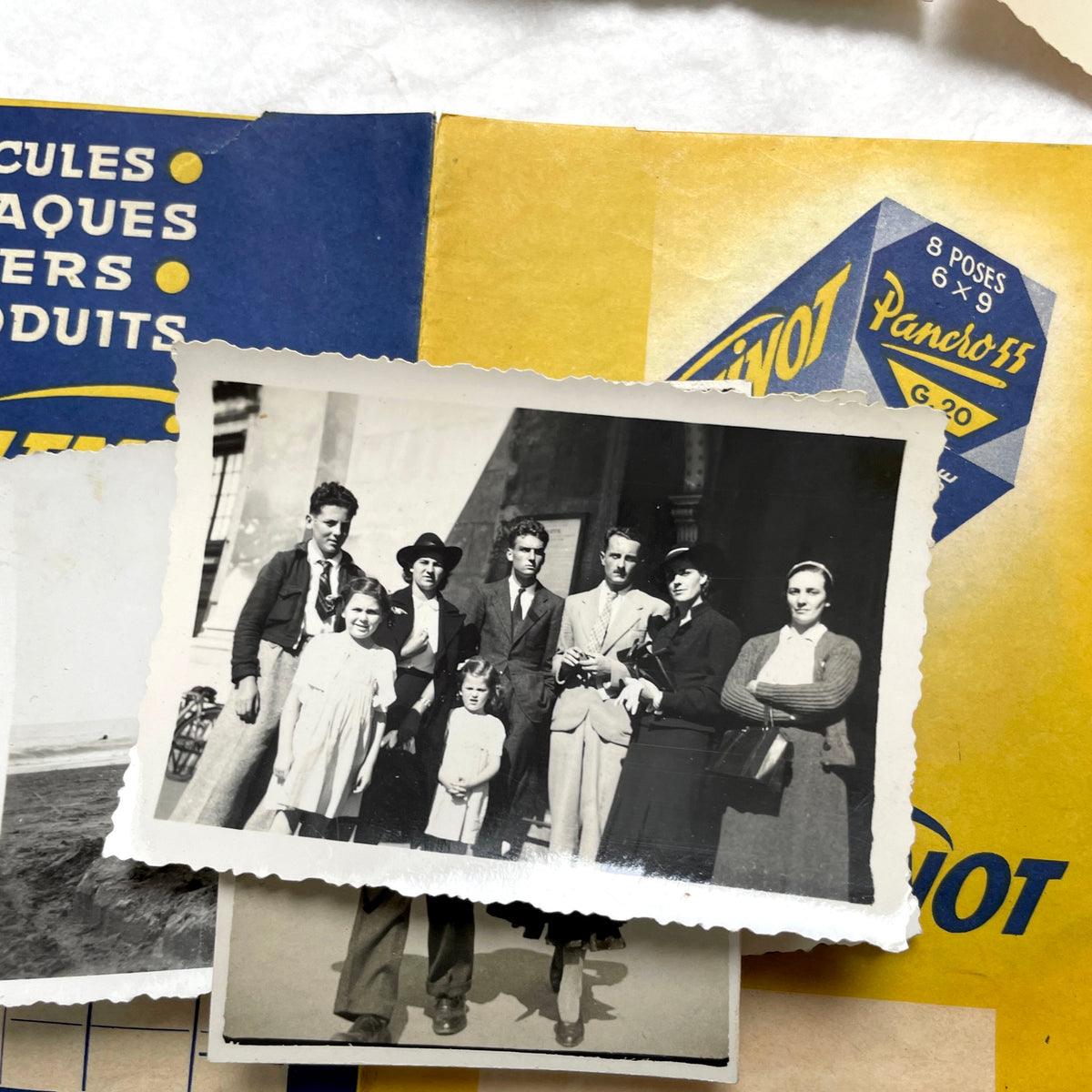 1930s vintage French photo lot with black and white pictures of family, children on the beach, and elegant couples.