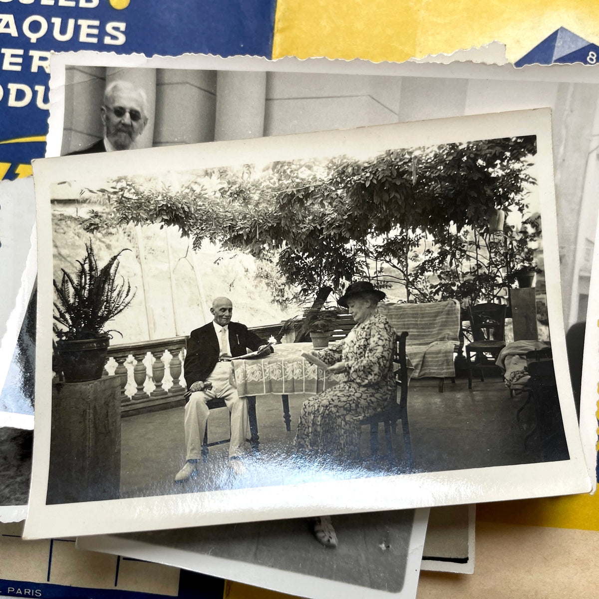 1930s vintage French photo lot with black and white pictures of family, children on the beach, and elegant couples.