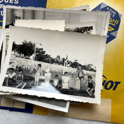 1930s vintage French photo lot with black and white pictures of family, children on the beach, and elegant couples.
