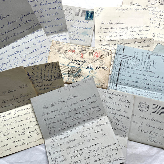 A collection of 1930s handwritten French letters and envelopes, featuring elegant script and vintage postmarks.