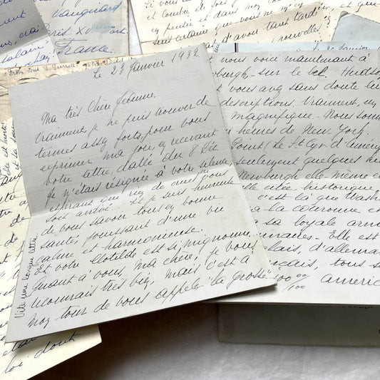 A collection of 1930s handwritten French letters and envelopes, featuring elegant script and vintage postmarks.