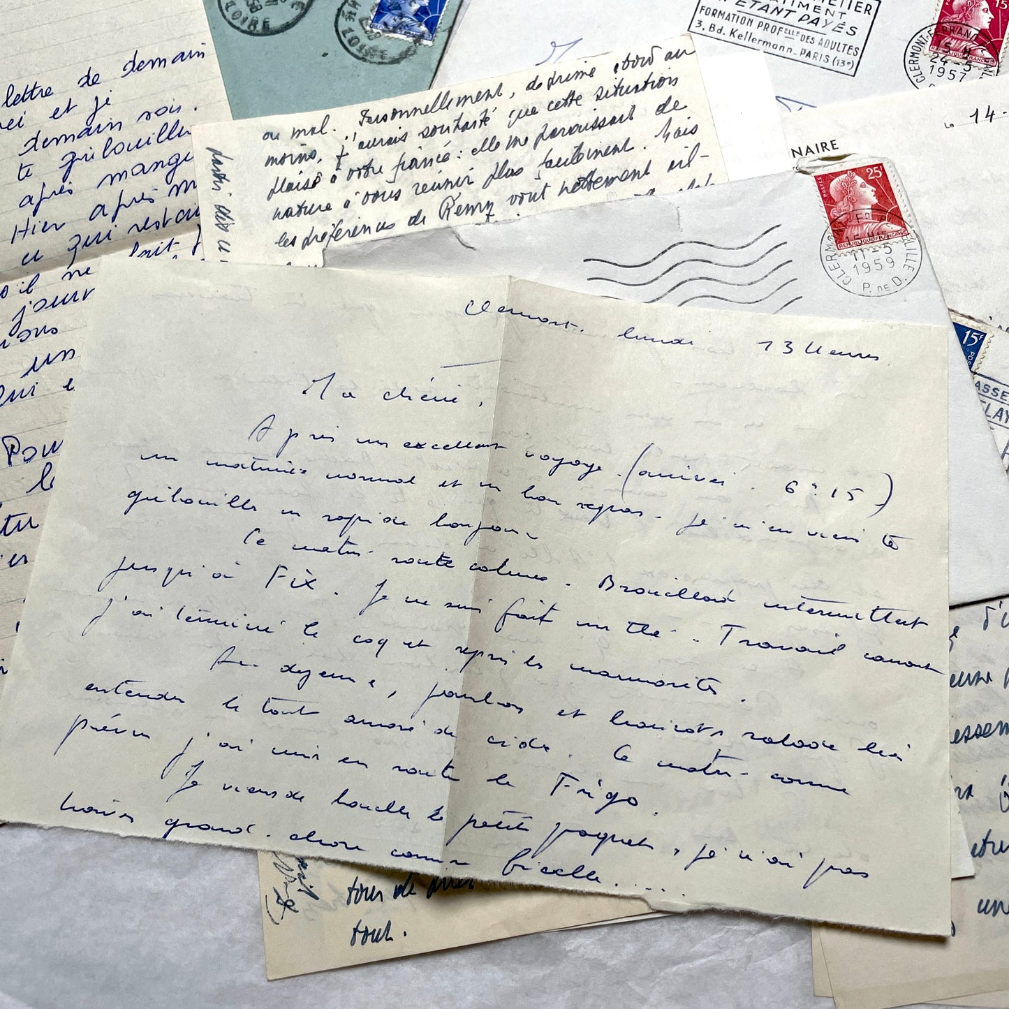 Set of 5 1950s French handwritten letters with envelopes and vintage stamps, showing personal correspondence.