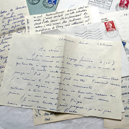 Set of 5 1950s French handwritten letters with envelopes and vintage stamps, showing personal correspondence.