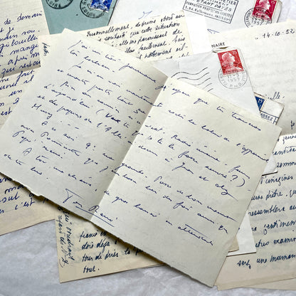 Set of 5 1950s French handwritten letters with envelopes and vintage stamps, showing personal correspondence.