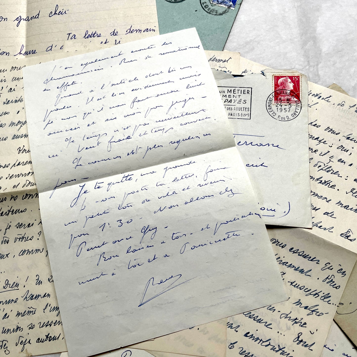 Set of 5 1950s French handwritten letters with envelopes and vintage stamps, showing personal correspondence.