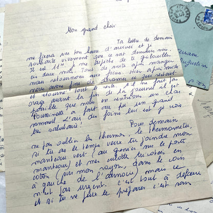 Set of 5 1950s French handwritten letters with envelopes and vintage stamps, showing personal correspondence.