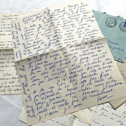 Set of 5 1950s French handwritten letters with envelopes and vintage stamps, showing personal correspondence.