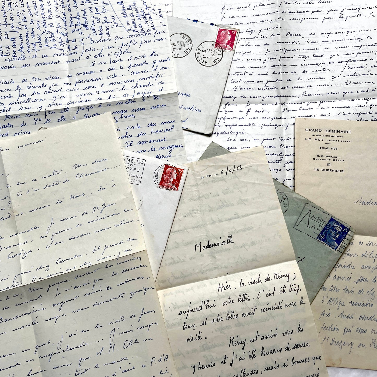 Set of 5 1950s French letters with envelopes, featuring handwritten script, vintage stamps, and postmarks.