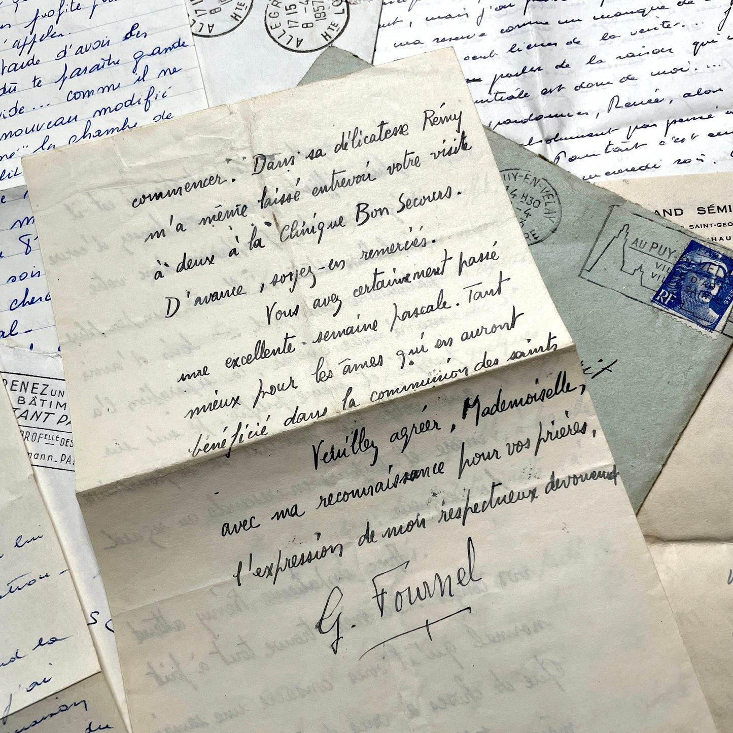 Set of 5 1950s French letters with envelopes, featuring handwritten script, vintage stamps, and postmarks.
