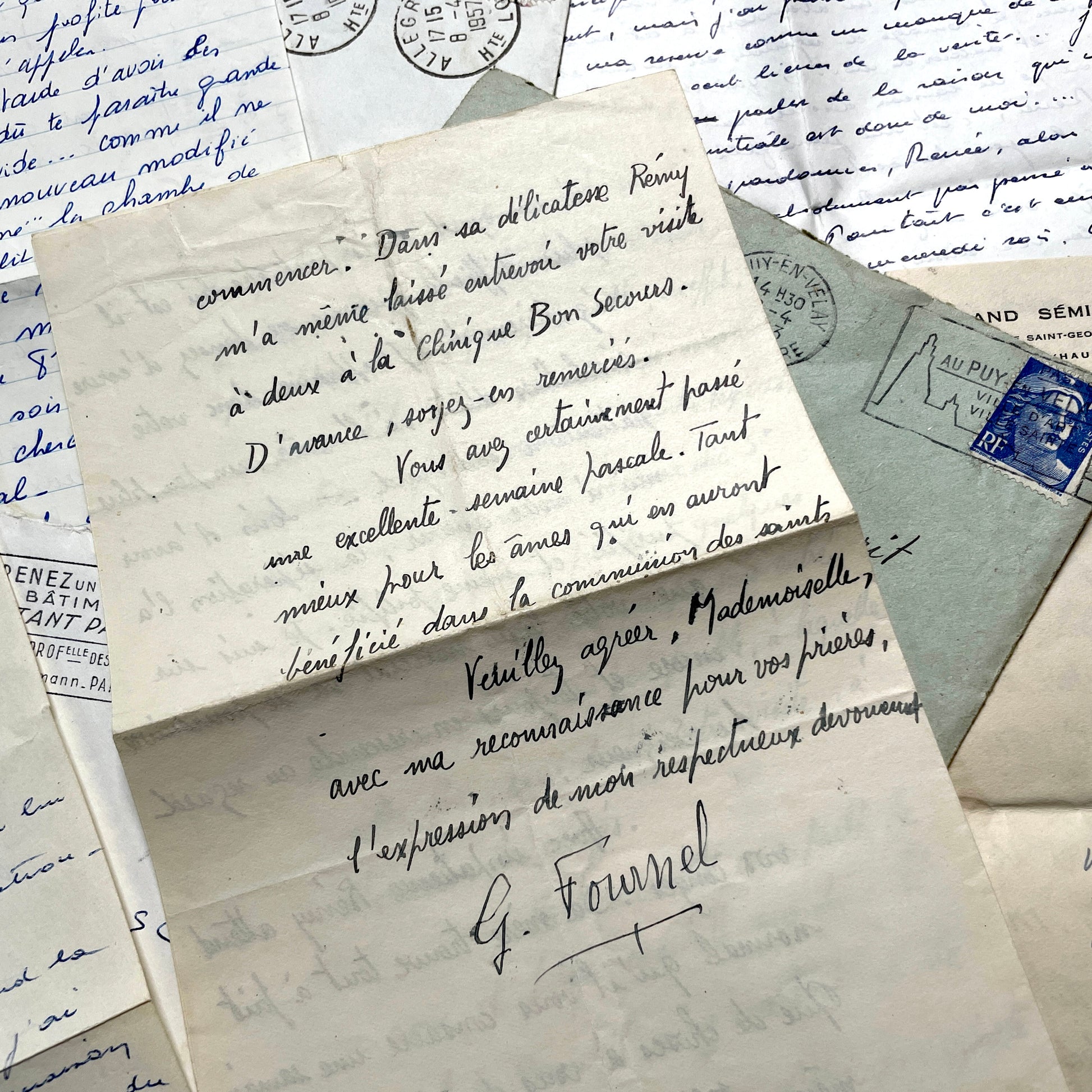Set of 5 1950s French letters with envelopes, featuring handwritten script, vintage stamps, and postmarks.