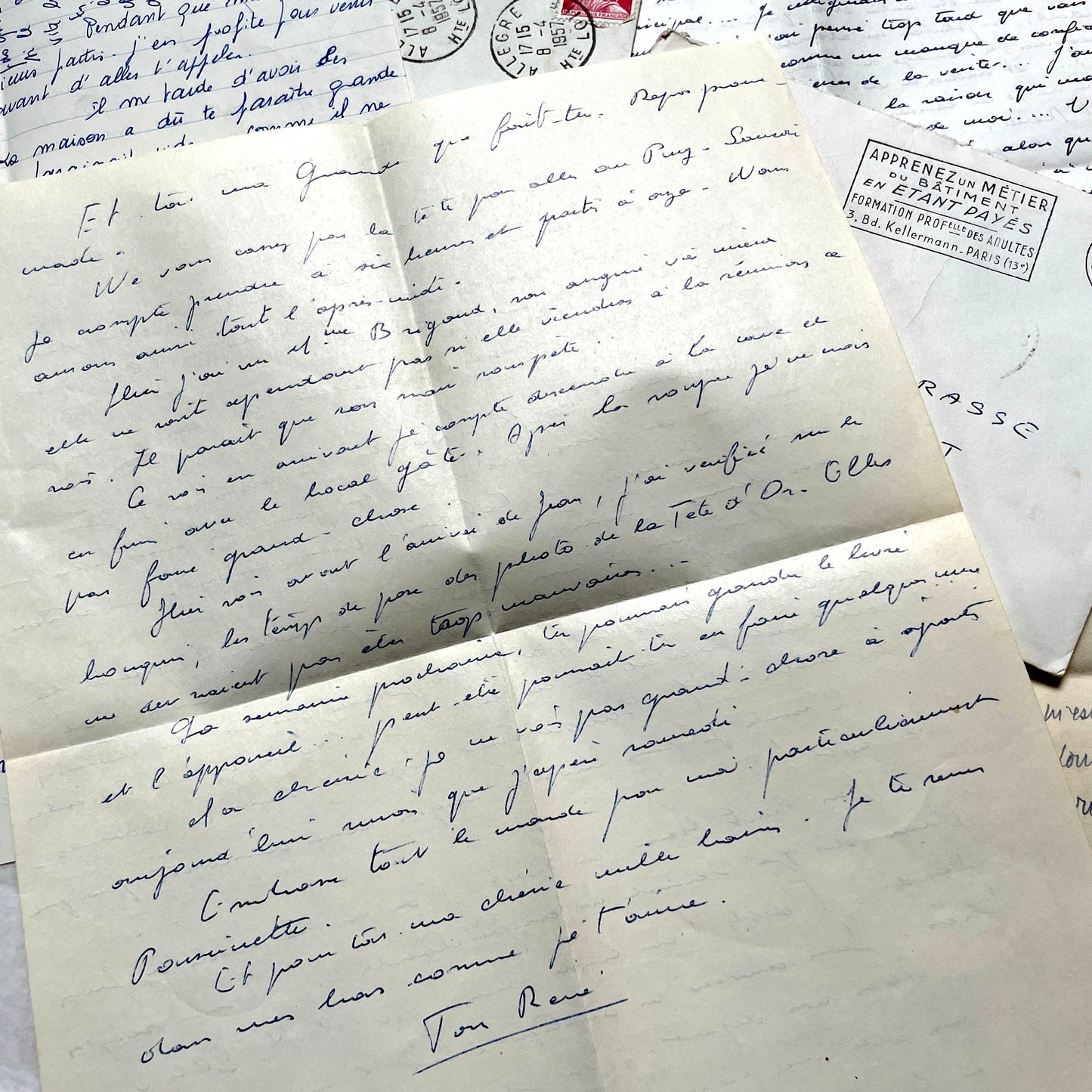 Set of 5 1950s French letters with envelopes, featuring handwritten script, vintage stamps, and postmarks.