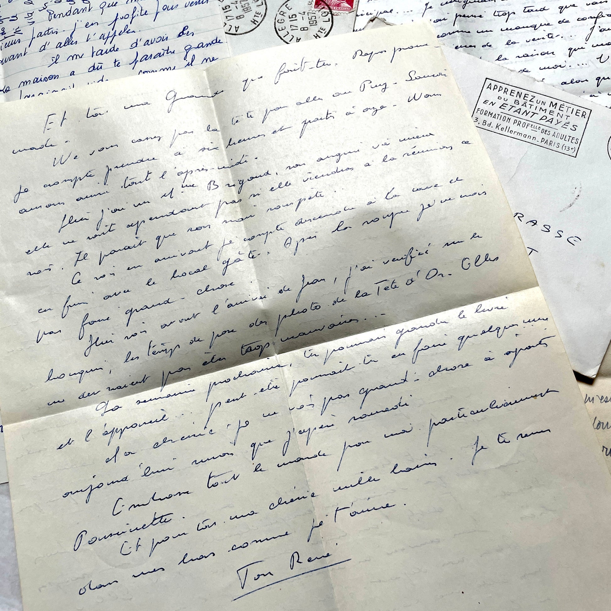 Set of 5 1950s French letters with envelopes, featuring handwritten script, vintage stamps, and postmarks.