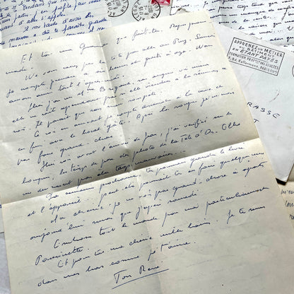 Set of 5 1950s French letters with envelopes, featuring handwritten script, vintage stamps, and postmarks.