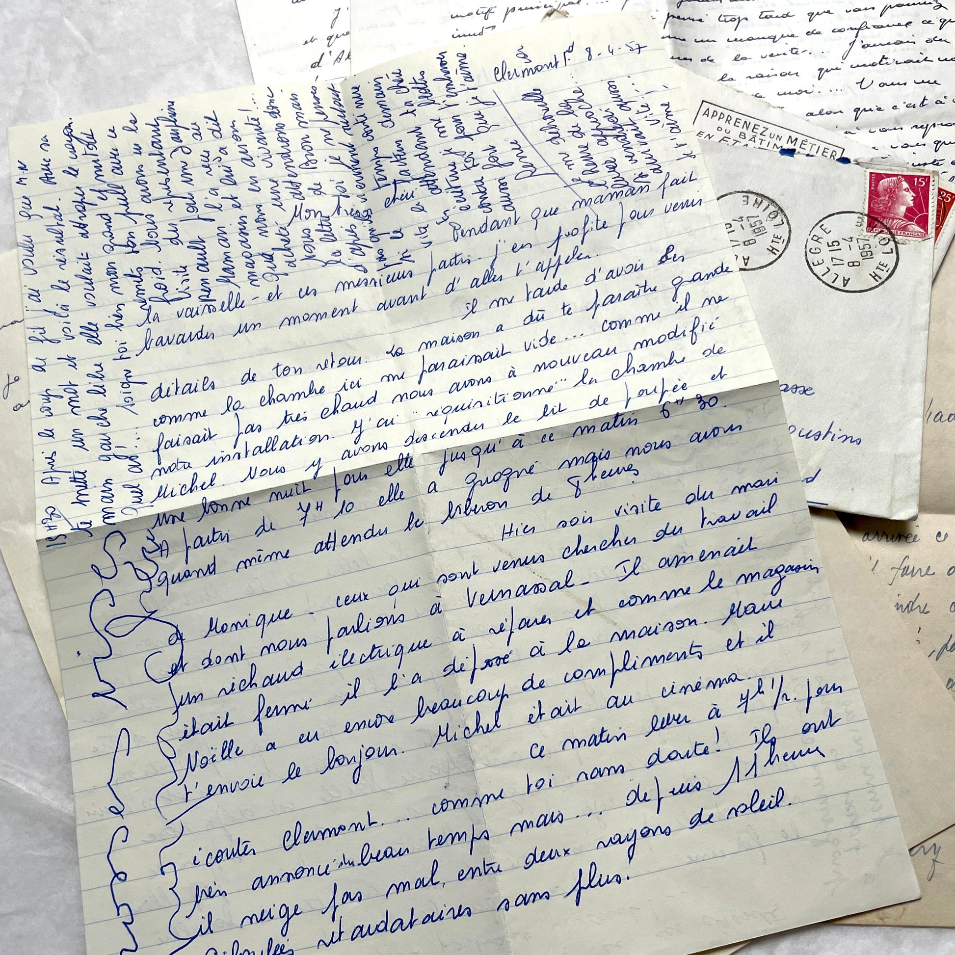 Set of 5 1950s French letters with envelopes, featuring handwritten script, vintage stamps, and postmarks.