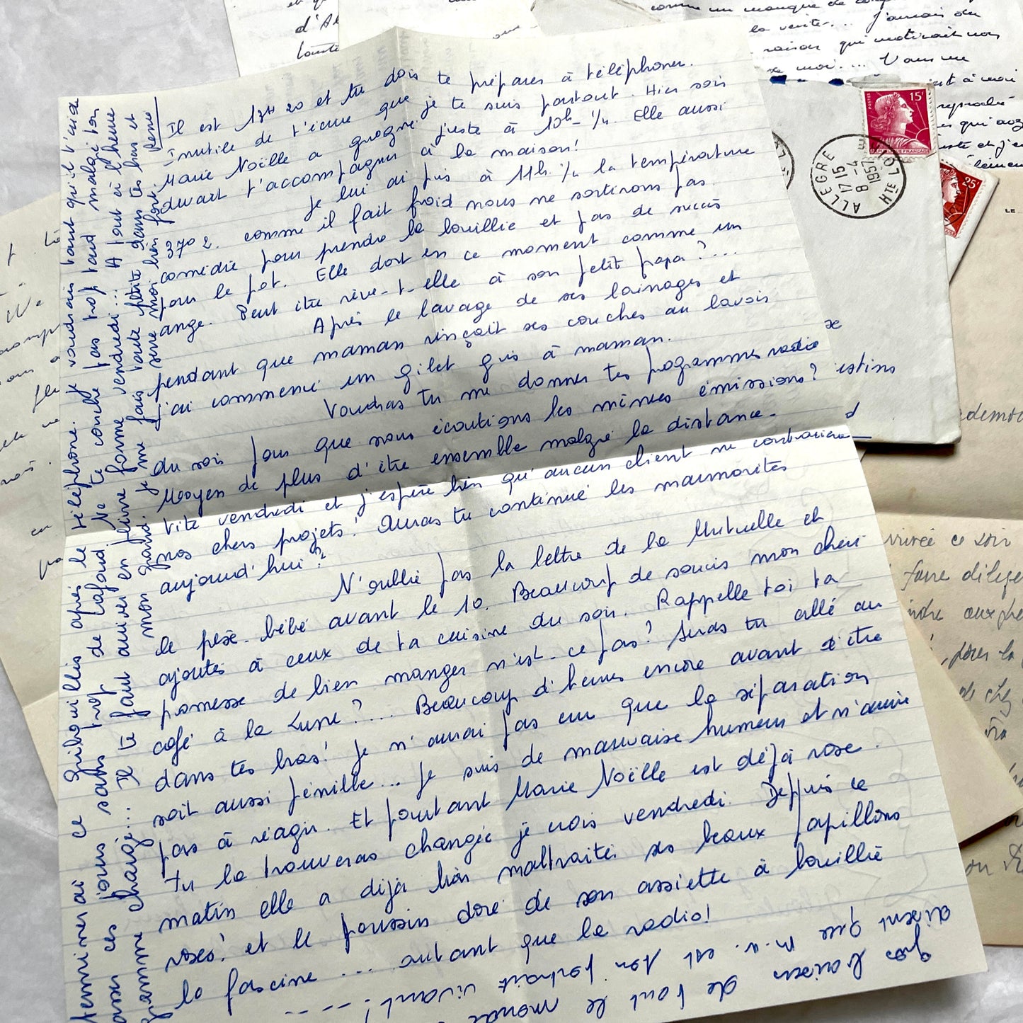Set of 5 1950s French letters with envelopes, featuring handwritten script, vintage stamps, and postmarks.