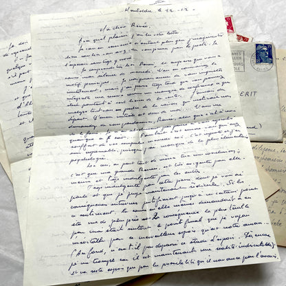 Set of 5 1950s French letters with envelopes, featuring handwritten script, vintage stamps, and postmarks.