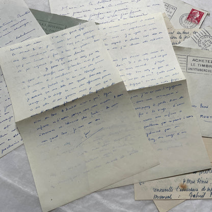 A set of 1950s French letters and envelopes with handwritten text, original stamps, and various postmarks from France.