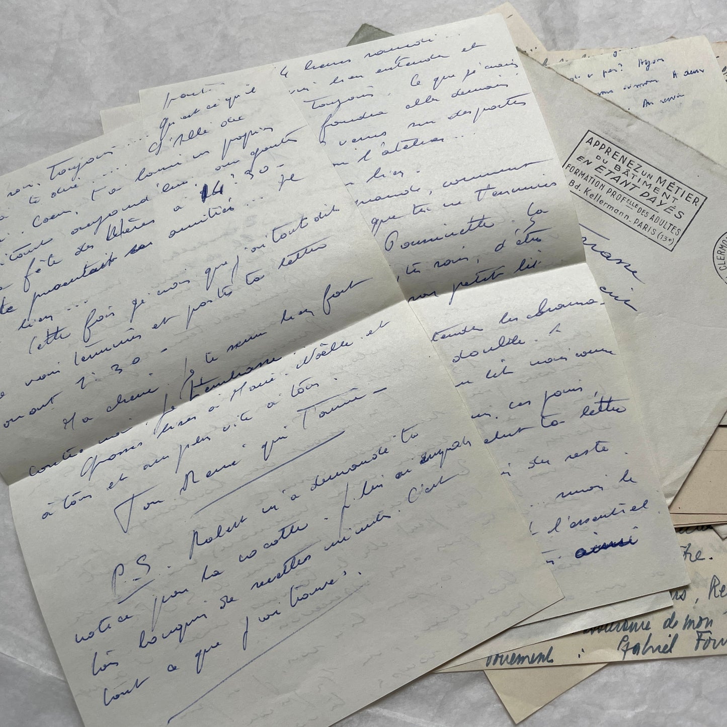 A set of 1950s French letters and envelopes with handwritten text, original stamps, and various postmarks from France.