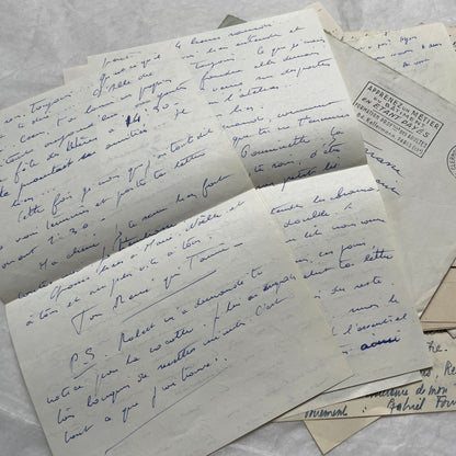 A set of 1950s French letters and envelopes with handwritten text, original stamps, and various postmarks from France.