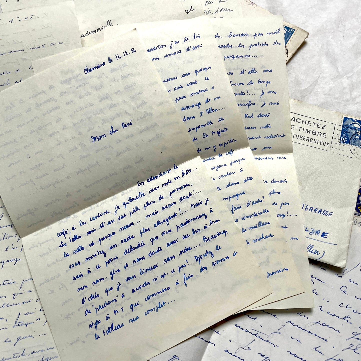 Set of 5 1950s French handwritten letters with envelopes, visible postage stamps and cursive text in French.