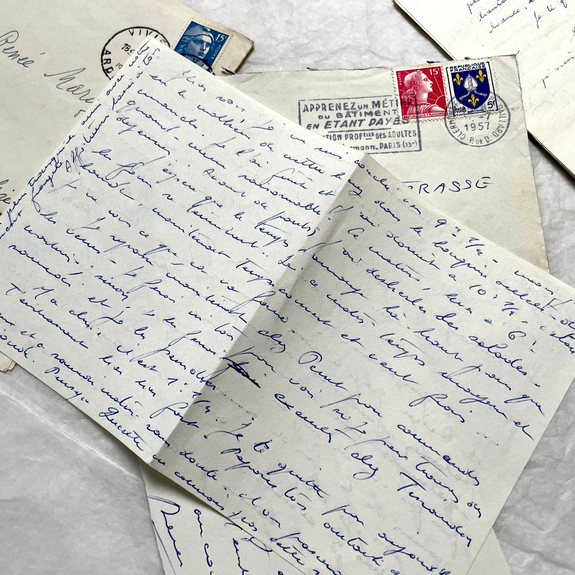 Set of 5 1950s French handwritten letters with envelopes, visible postage stamps and cursive text in French.