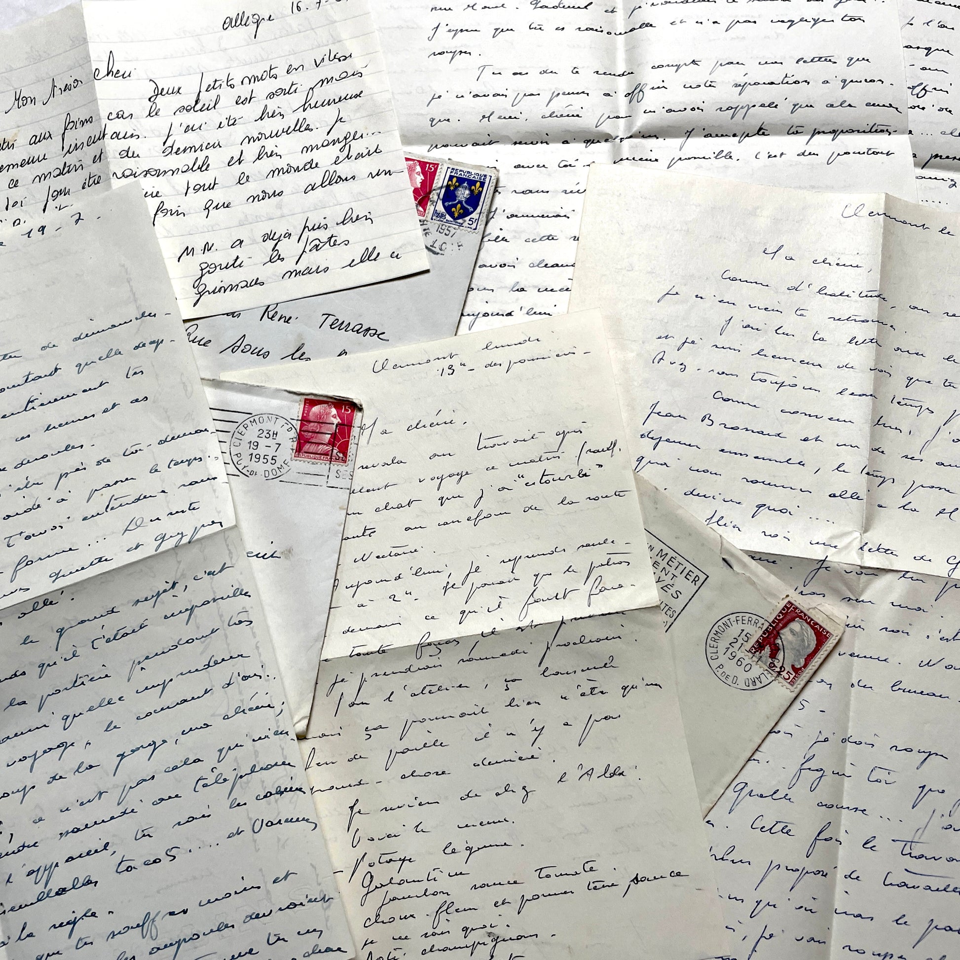1950s French letters set with handwritten text, envelopes, and vintage postage stamps from Clermont-Ferrand.