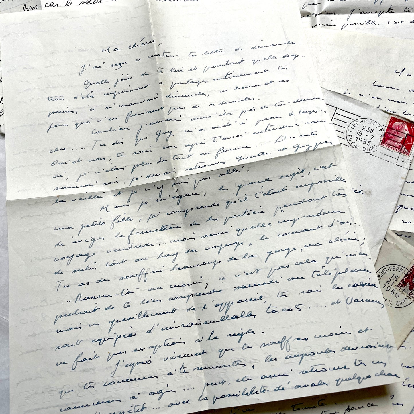 1950s French letters set with handwritten text, envelopes, and vintage postage stamps from Clermont-Ferrand.