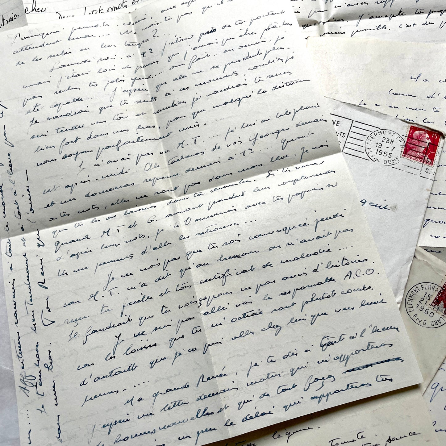 1950s French letters set with handwritten text, envelopes, and vintage postage stamps from Clermont-Ferrand.