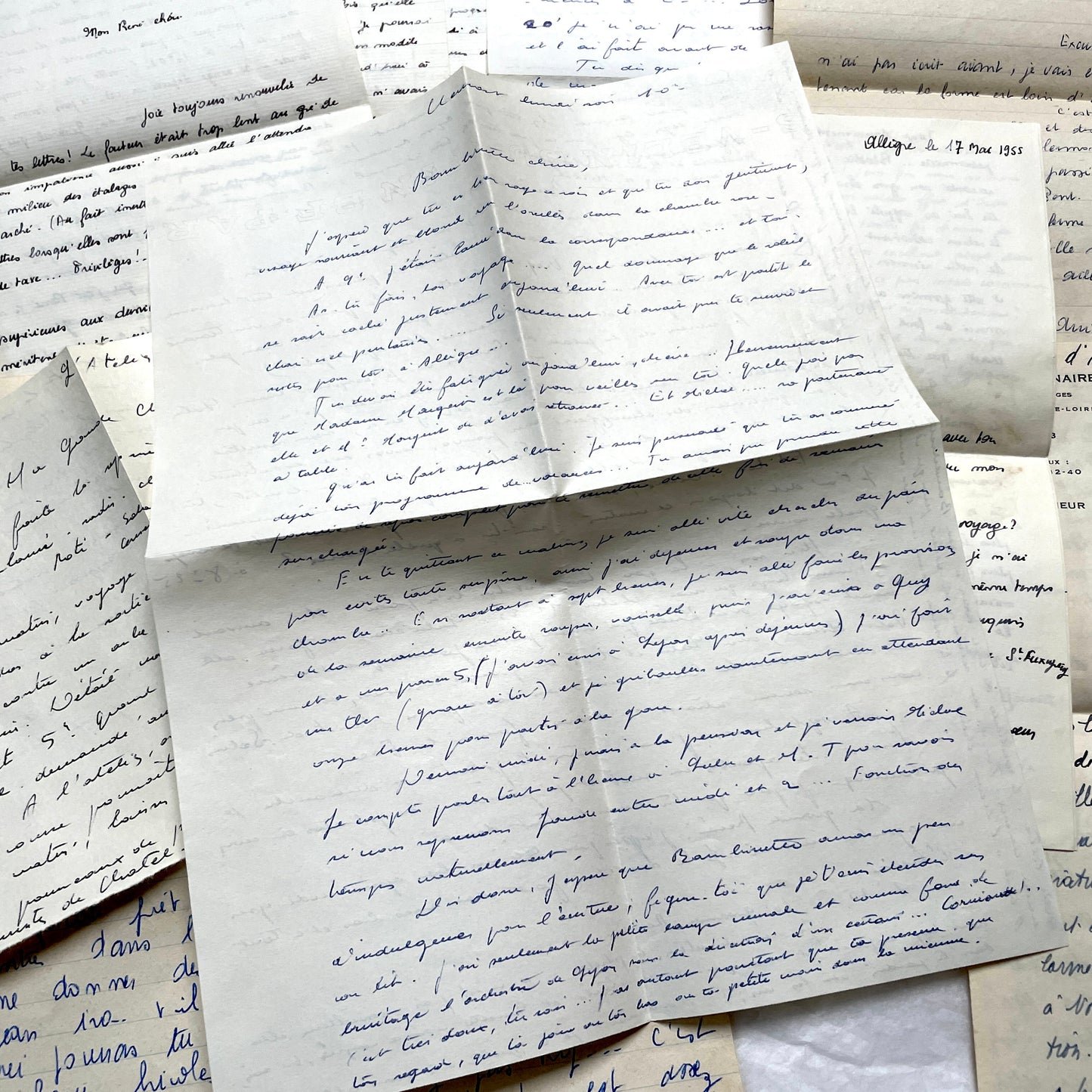 1950s French handwritten letters set with various penmanship styles and vintage paper textures.