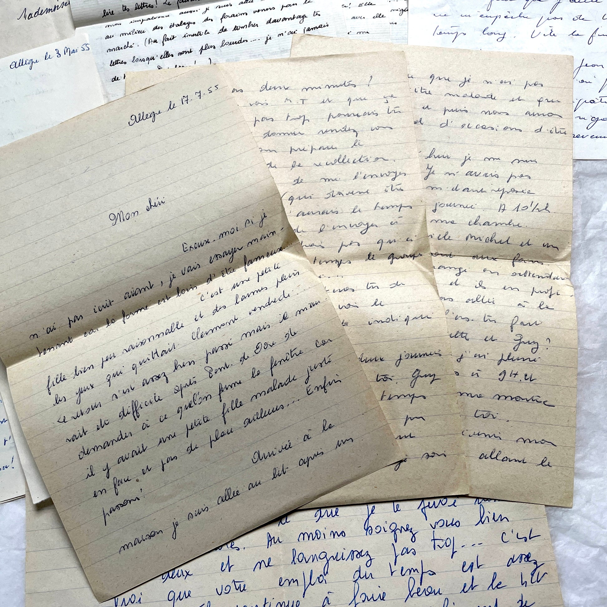 1950s French handwritten letters set with various penmanship styles and vintage paper textures.