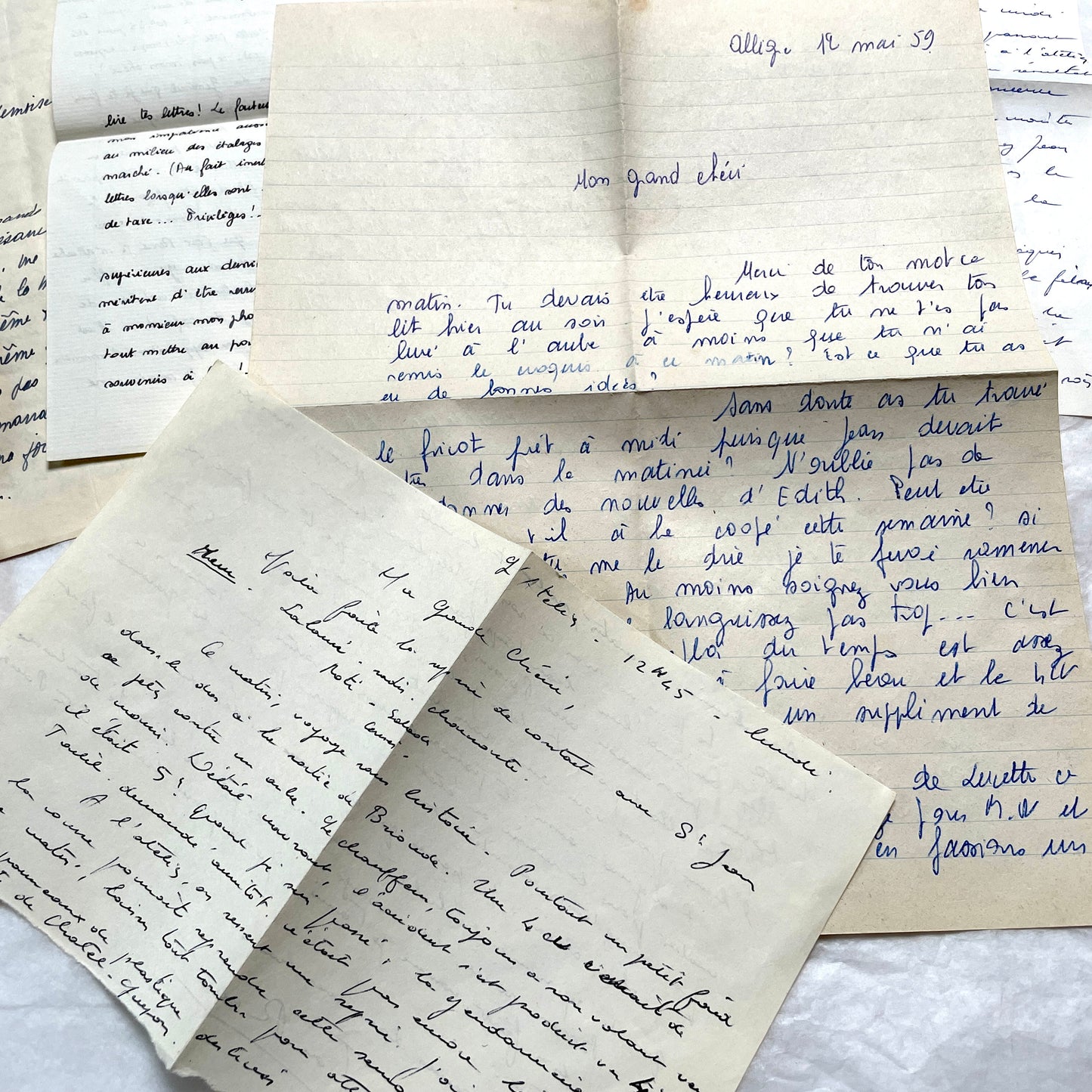 1950s French handwritten letters set with various penmanship styles and vintage paper textures.