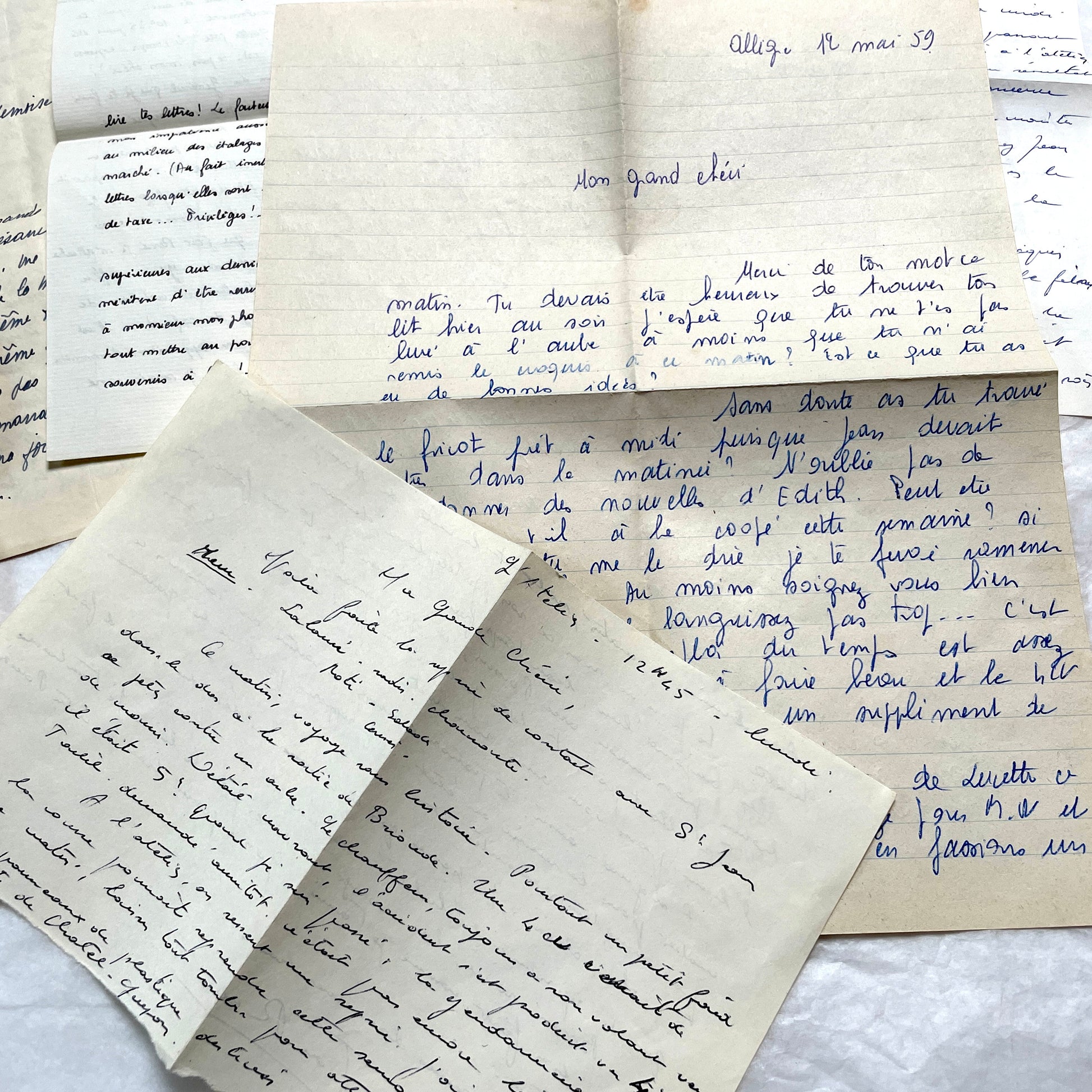 1950s French handwritten letters set with various penmanship styles and vintage paper textures.