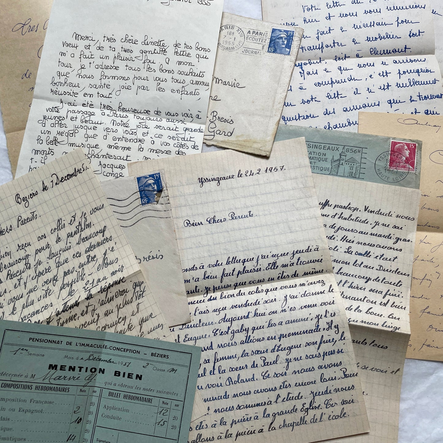 Five 1950s French handwritten letters with envelopes, showing vintage stamps and unique cursive script.