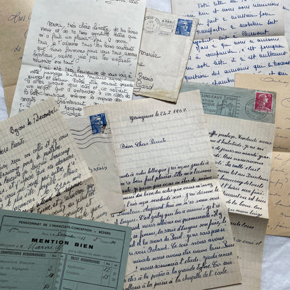 Five 1950s French handwritten letters with envelopes, showing vintage stamps and unique cursive script.