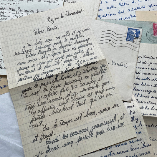 Five 1950s French handwritten letters with envelopes, showing vintage stamps and unique cursive script.