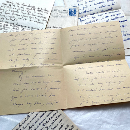 Five 1950s French handwritten letters with envelopes, showing vintage stamps and unique cursive script.