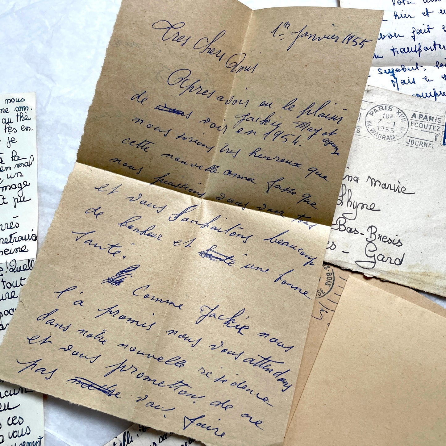 Five 1950s French handwritten letters with envelopes, showing vintage stamps and unique cursive script.
