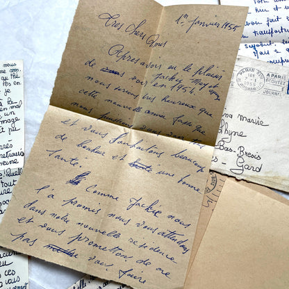 Five 1950s French handwritten letters with envelopes, showing vintage stamps and unique cursive script.