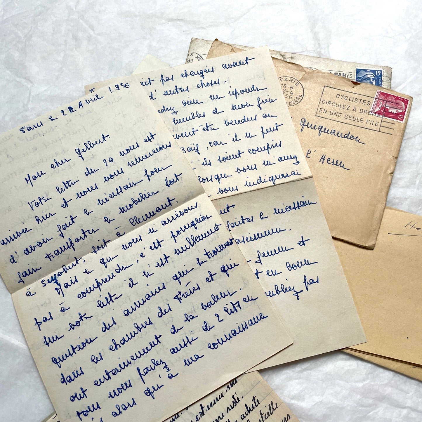 Five 1950s French handwritten letters with envelopes, showing vintage stamps and unique cursive script.