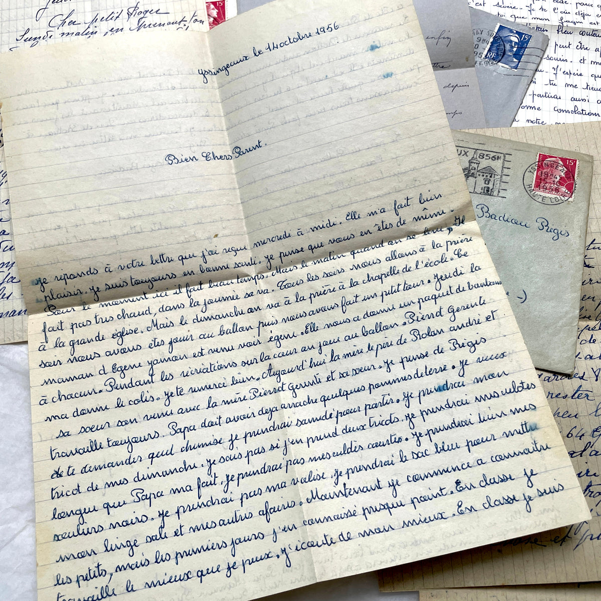 Five French letters from the 1940s and 1950s with handwritten text, original envelopes, and vintage postage stamps.