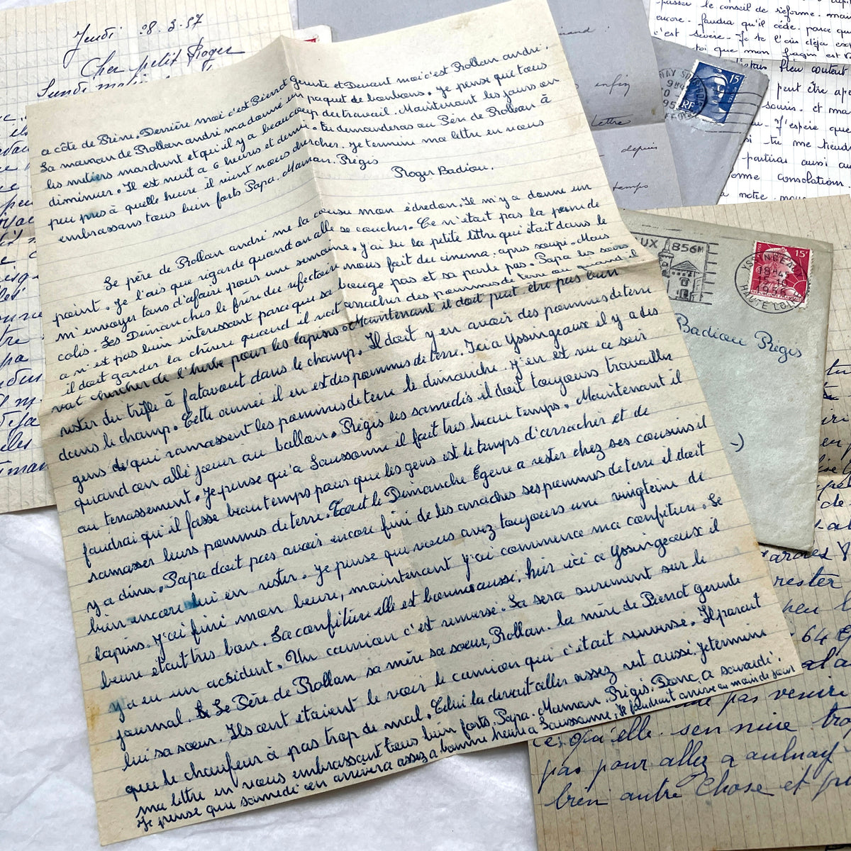 Five French letters from the 1940s and 1950s with handwritten text, original envelopes, and vintage postage stamps.
