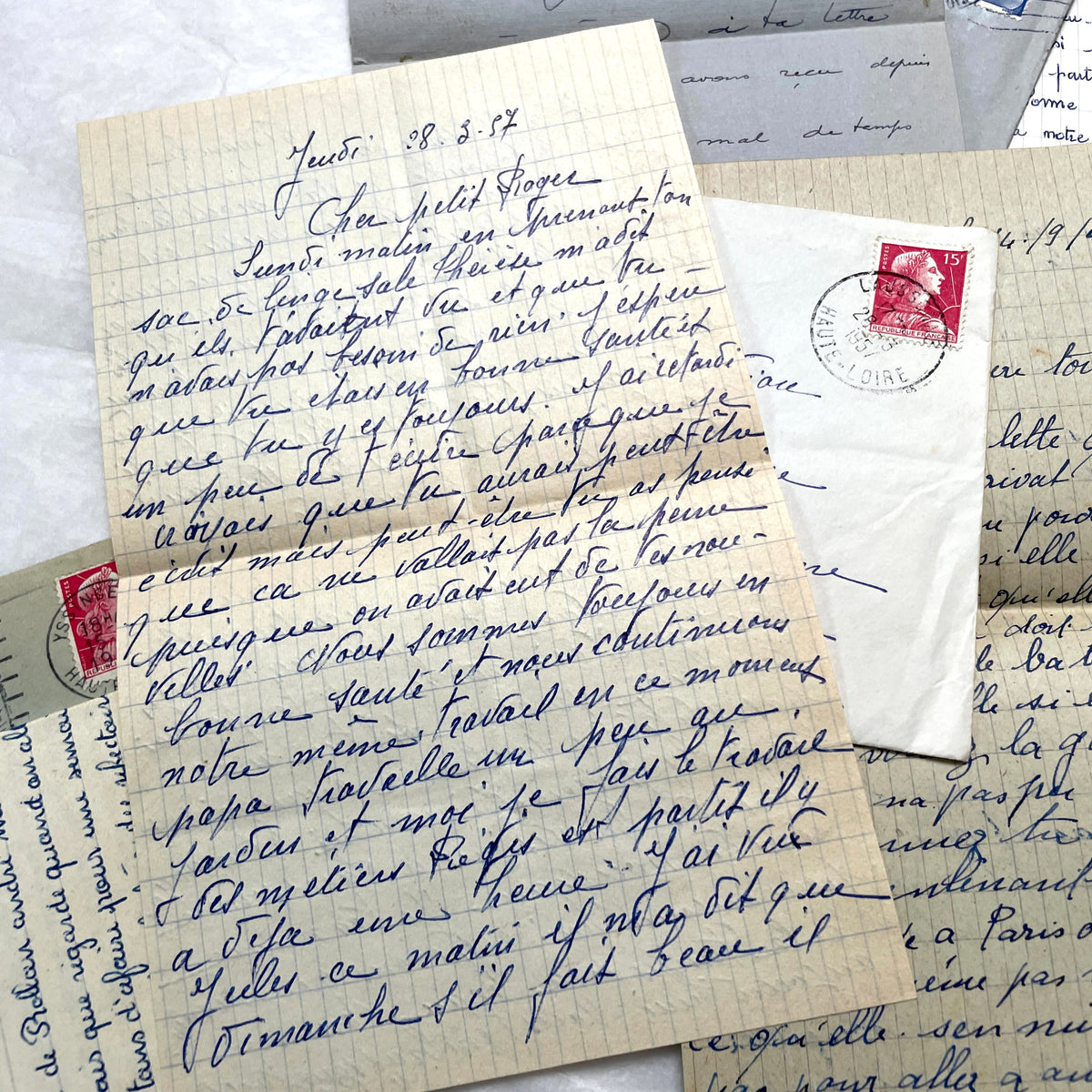 Five French letters from the 1940s and 1950s with handwritten text, original envelopes, and vintage postage stamps.