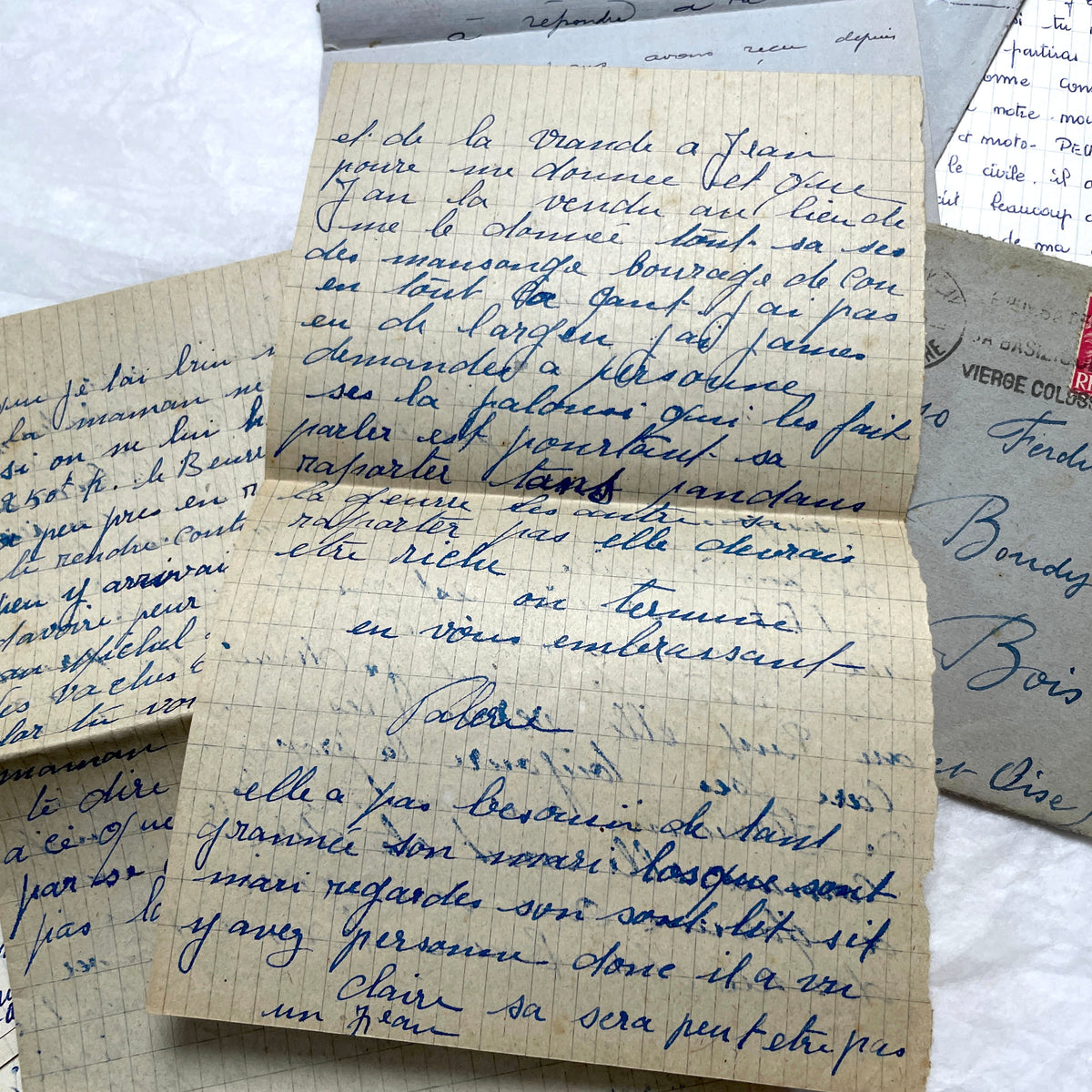 Five French letters from the 1940s and 1950s with handwritten text, original envelopes, and vintage postage stamps.