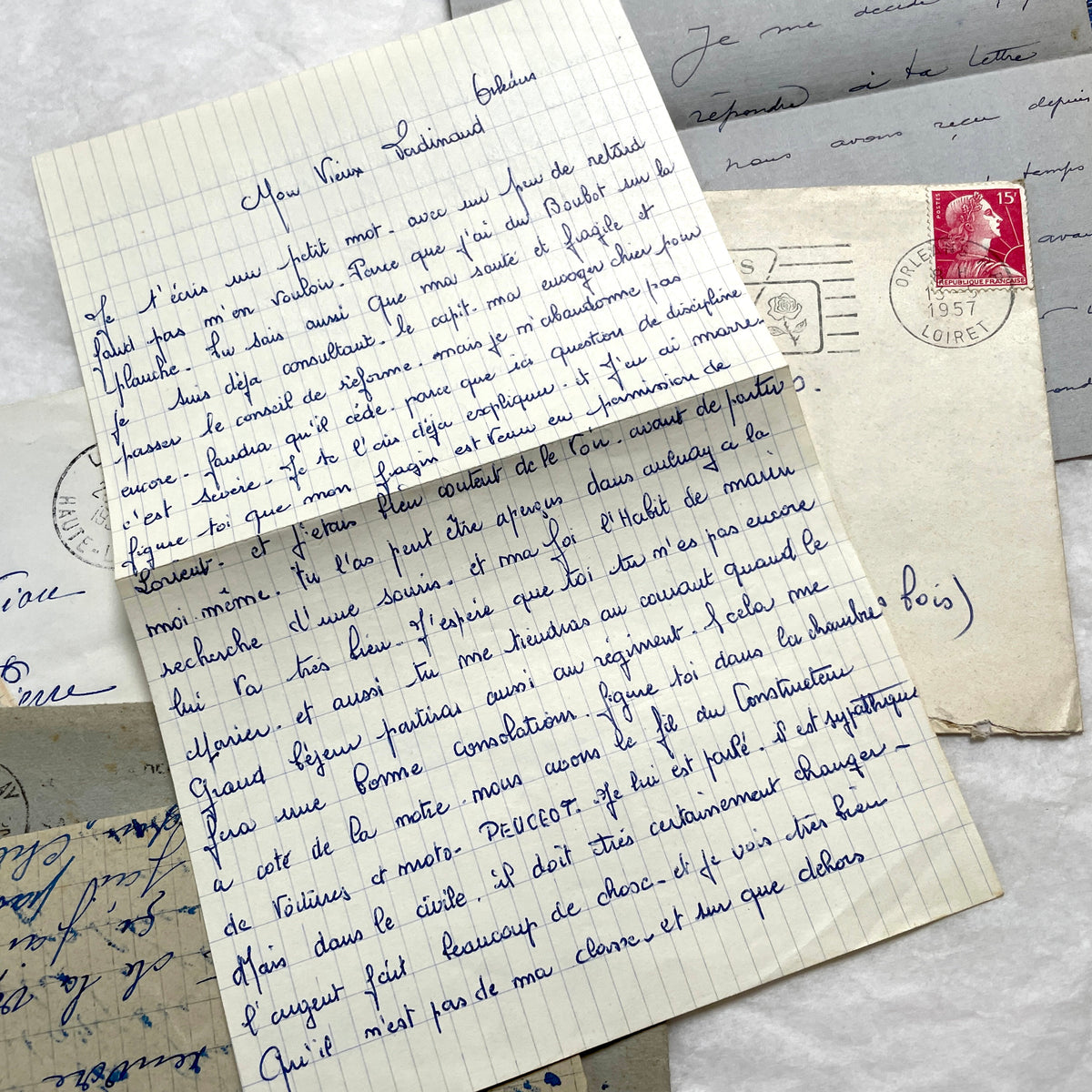 Five French letters from the 1940s and 1950s with handwritten text, original envelopes, and vintage postage stamps.