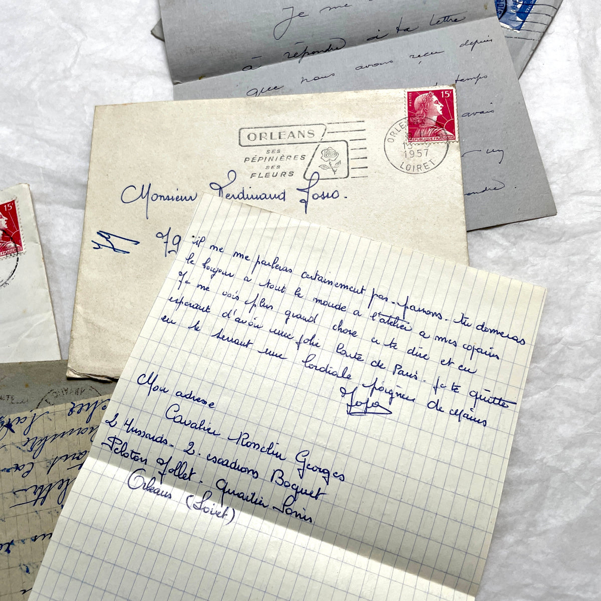 Five French letters from the 1940s and 1950s with handwritten text, original envelopes, and vintage postage stamps.