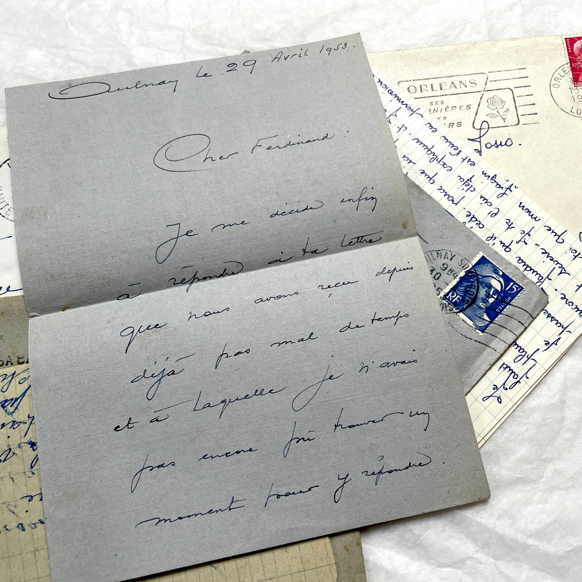 Five French letters from the 1940s and 1950s with handwritten text, original envelopes, and vintage postage stamps.